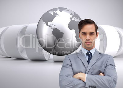 Composite image of young businessman looking at camera