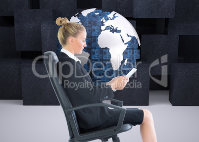 Composite image of businesswoman sitting on swivel chair with ta