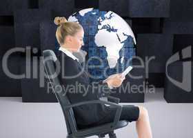 Composite image of businesswoman sitting on swivel chair with ta