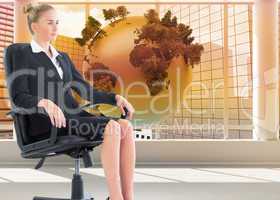 Composite image of businesswoman sitting on swivel chair in blac