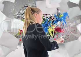 Composite image of businesswoman pointing somewhere