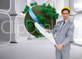 Composite image of serious architect with hard hat holding plans