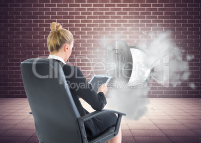 Composite image of businesswoman sitting on swivel chair with ta