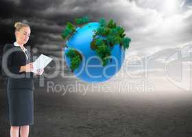 Composite image of businesswoman holding new tablet