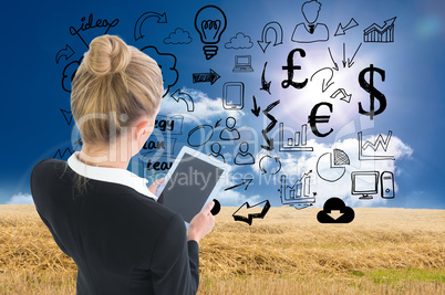 Composite image of businesswoman holding new tablet