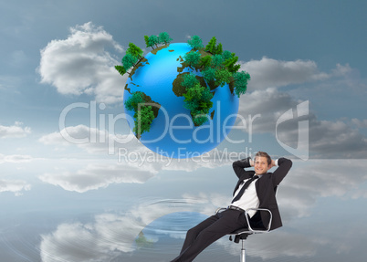 Composite image of manager relaxing in office with team in backg