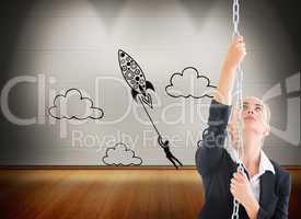 Composite image of businesswoman pulling a chain