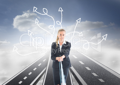 Composite image of businesswoman pulling a rope