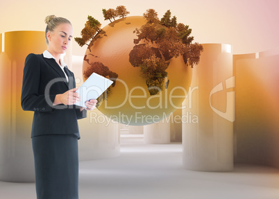 Composite image of businesswoman holding new tablet