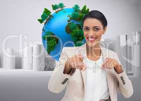 Composite image of smiling businesswoman pointing at the camera