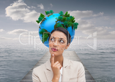 Composite image of smiling businesswoman thinking