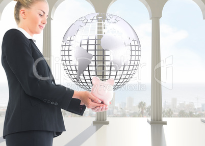 Composite image of businesswoman holding piggy bank