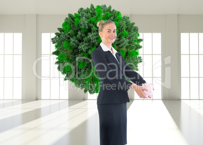 Composite image of businesswoman holding pink piggy bank