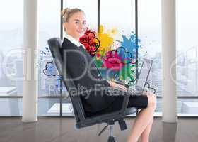 Composite image of businesswoman sitting on swivel chair with la