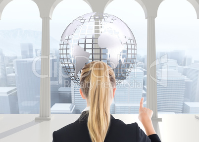 Composite image of business woman pointing somewhere