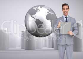 Composite image of happy businessman holding a clipboard