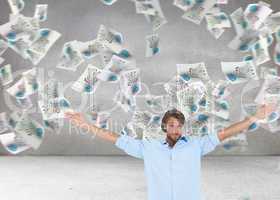 Composite image of handsome man raising hands