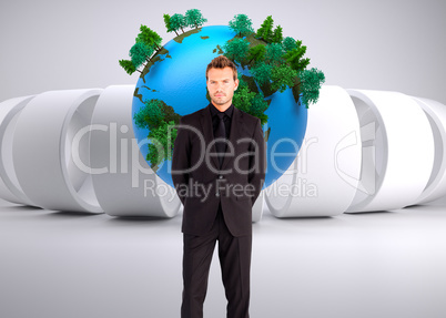 Composite image of young businessman looking at the camera