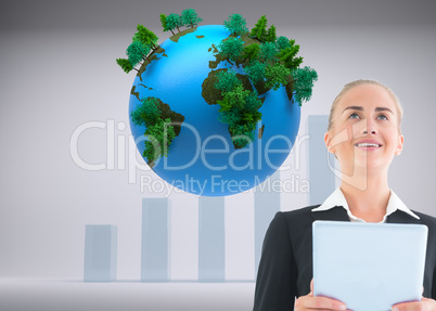 Composite image of businesswoman holding tablet