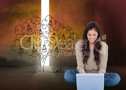 Composite image of brunette sitting on floor using laptop