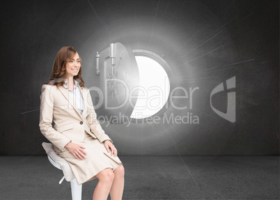 Composite image of smiling businesswoman sitting