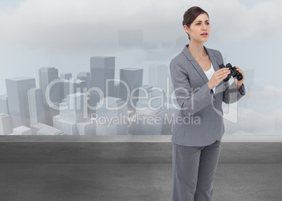 Composite image of curious young businesswoman with binoculars