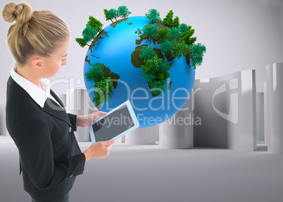 Composite image of businesswoman holding new tablet