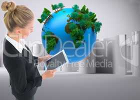 Composite image of businesswoman holding new tablet