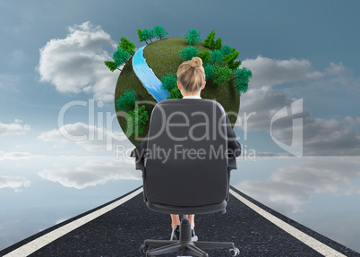 Composite image of businesswoman sitting on swivel chair