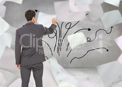 Composite image of businessman standing back to camera writing w