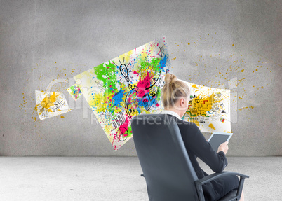 Composite image of businesswoman sitting on swivel chair with ta