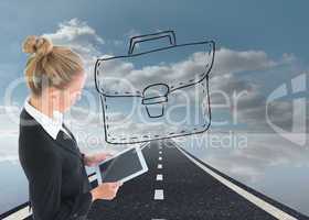 Composite image of businesswoman holding tablet