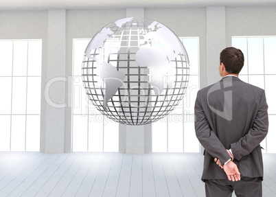 Composite image of rear view of classy businessman posing