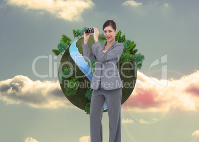 Composite image of businesswoman posing with binoculars