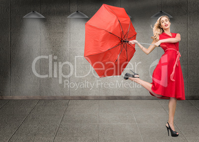 Composite image of elegant blonde holding umbrella