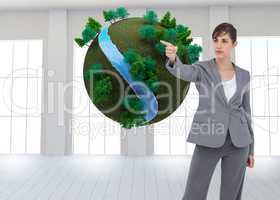 Composite image of young businesswoman pointing to something