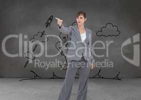 Composite image of young businesswoman pointing to something