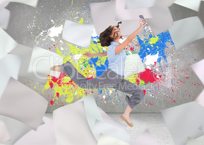 Composite image of happy classy businesswoman jumping while hold