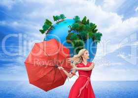 Composite image of elegant blonde holding umbrella