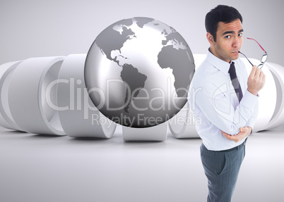 Composite image of unsmiling businessman holding glasses