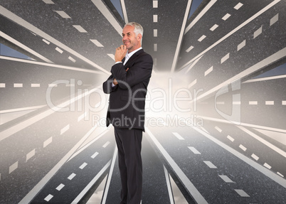 Composite image of happy businessman looking away