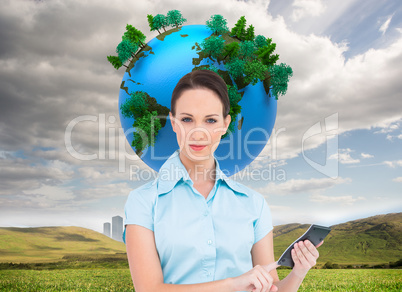 Composite image of serious classy businesswoman using calculator