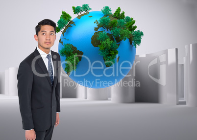 Composite image of serious asian businessman