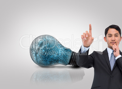 Composite image of thoughtful asian businessman pointing