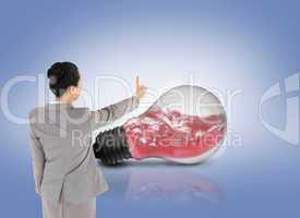 Composite image of asian businesswoman pointing