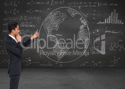 Composite image of thoughtful asian businessman pointing