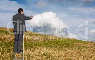 Composite image of businessman standing on ladder