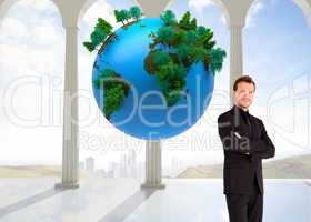 Composite image of handsome businessman with crossed arms