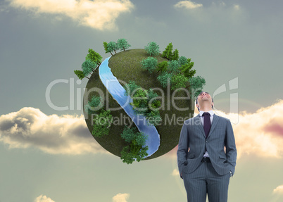 Composite image of smiling businessman standing