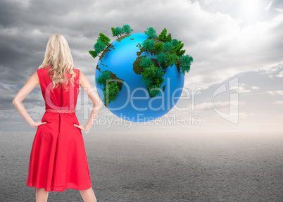 Composite image of elegant blonde standing hands on hips